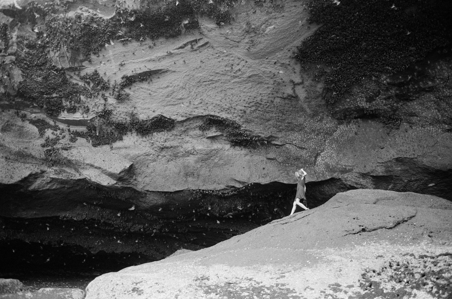 Man-made caves carved into dramatic cliff faces in a remote Himalayan valley