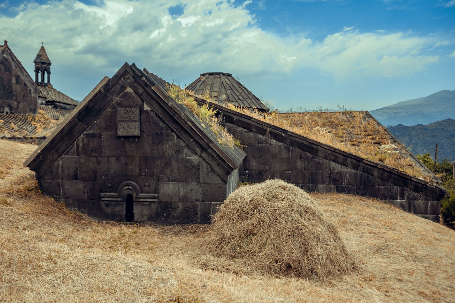 Traditional Armenian village nestled in a steep mountain gorge with forested slopes