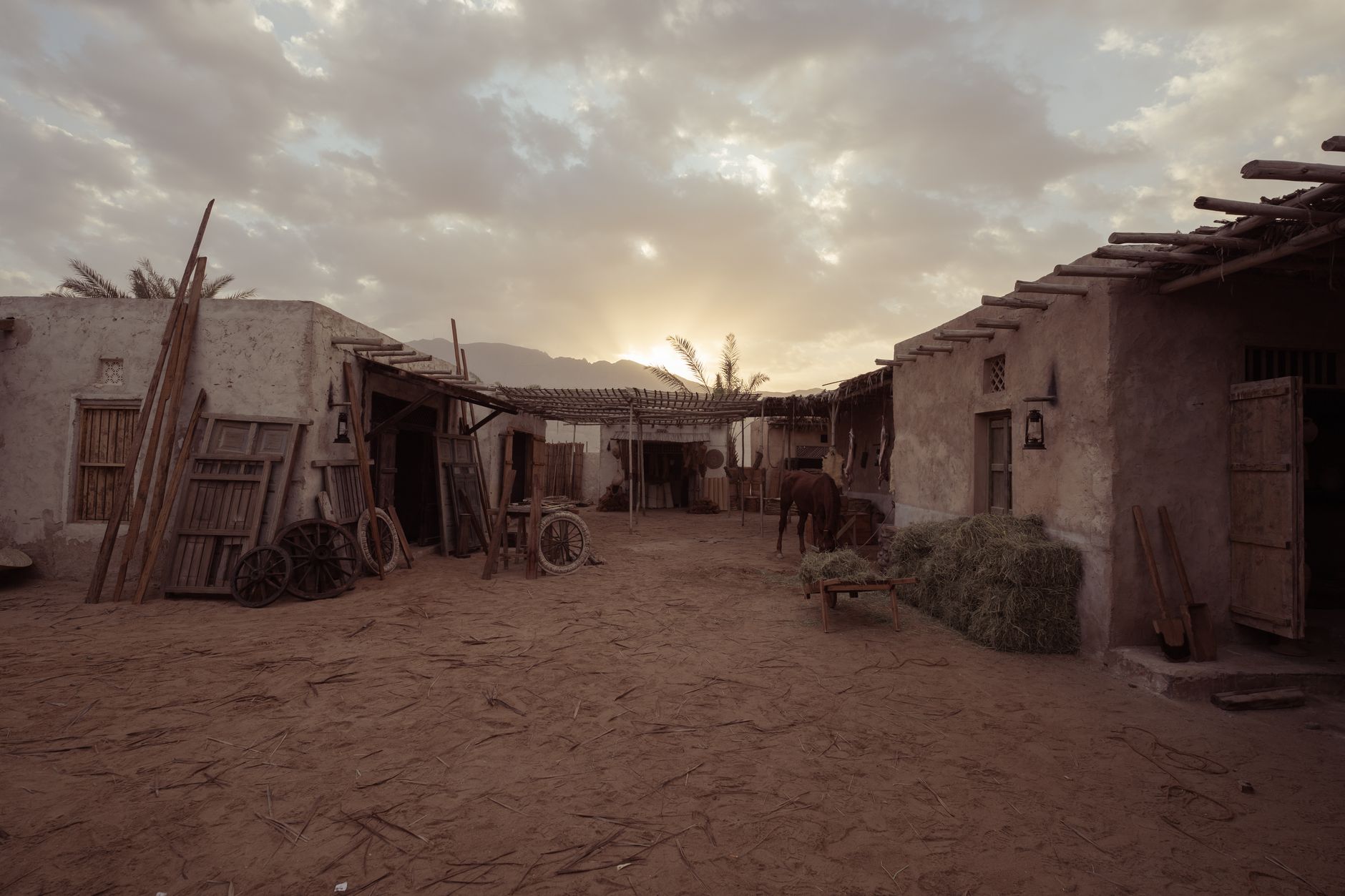 Traditional whitewashed adobe village buildings in a high-altitude South American desert setting