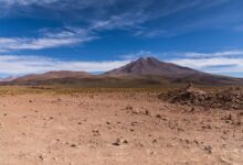 Snow-capped peaks rising above high-altitude puna grassland in Bolivia's remote Cordillera Apolobamba range