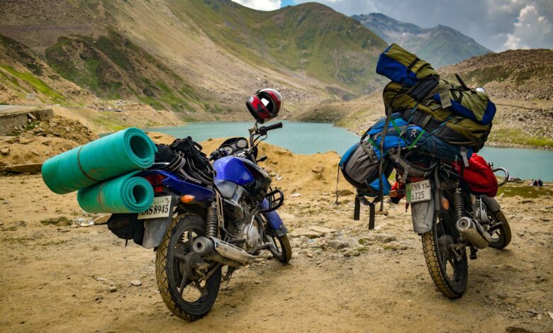 A motorbike rider navigating a steep mountain pass on a narrow road in northern Vietnam