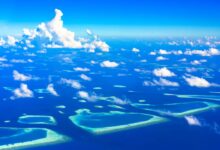 Aerial view of remote tropical islands surrounded by turquoise Andaman Sea water