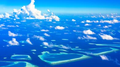 Aerial view of remote tropical islands surrounded by turquoise Andaman Sea water