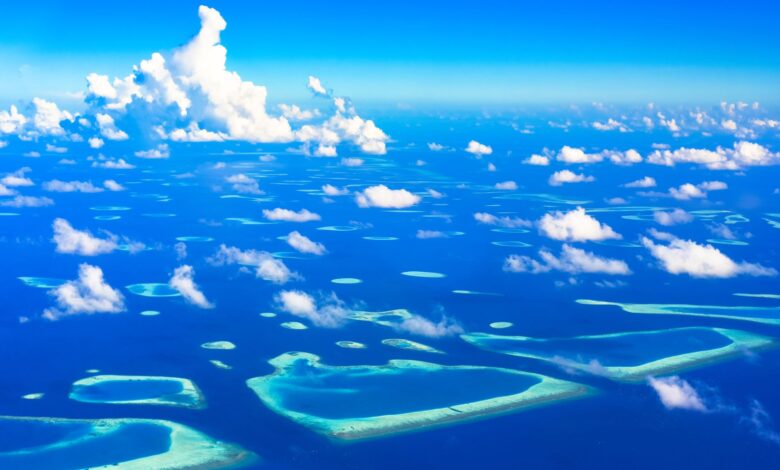 Aerial view of remote tropical islands surrounded by turquoise Andaman Sea water