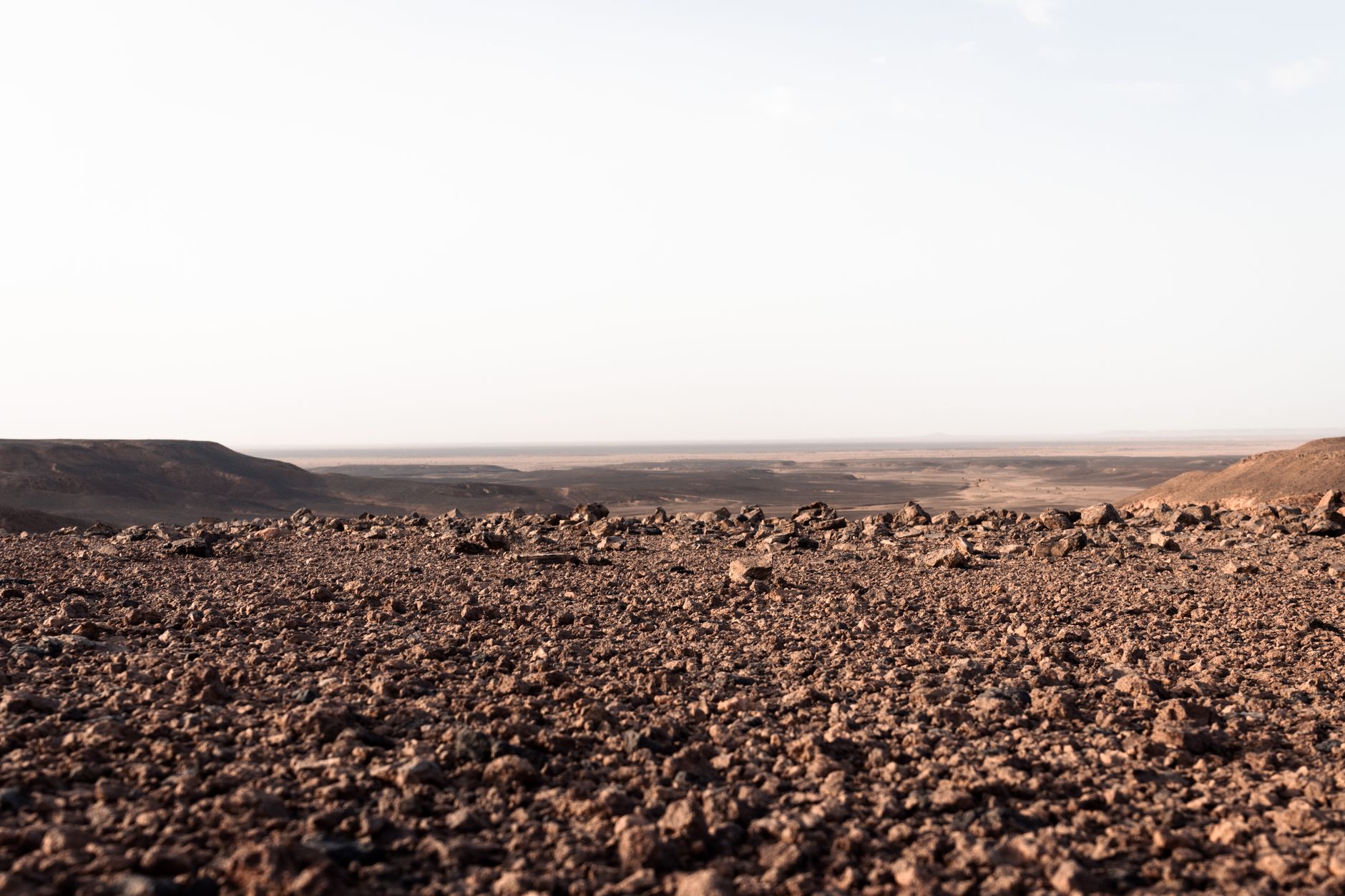 Vast sandstone plateau in the Sahara desert under clear blue sky