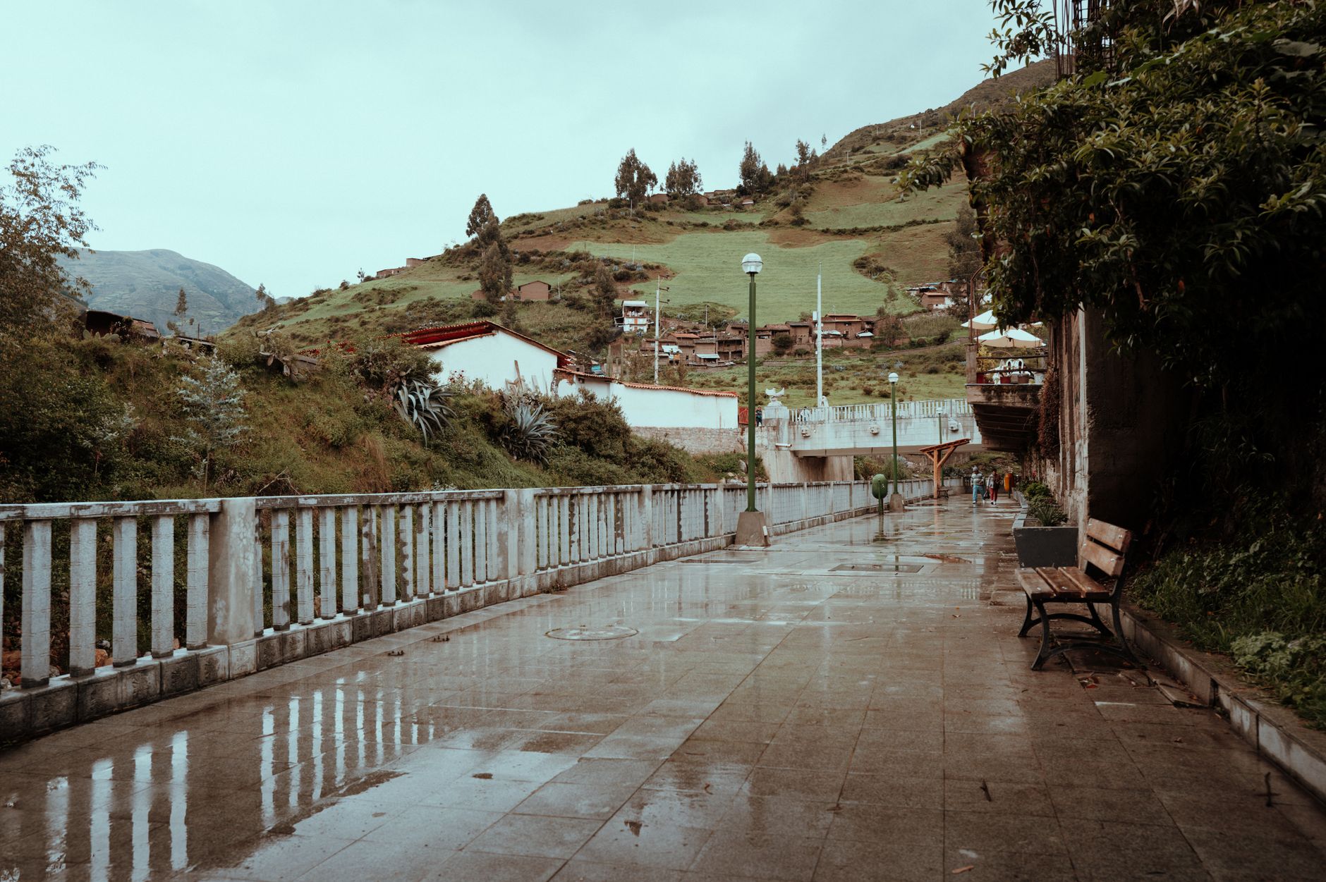 Dirt hiking trail winding through a remote Andean village in the Ecuadorian highlands