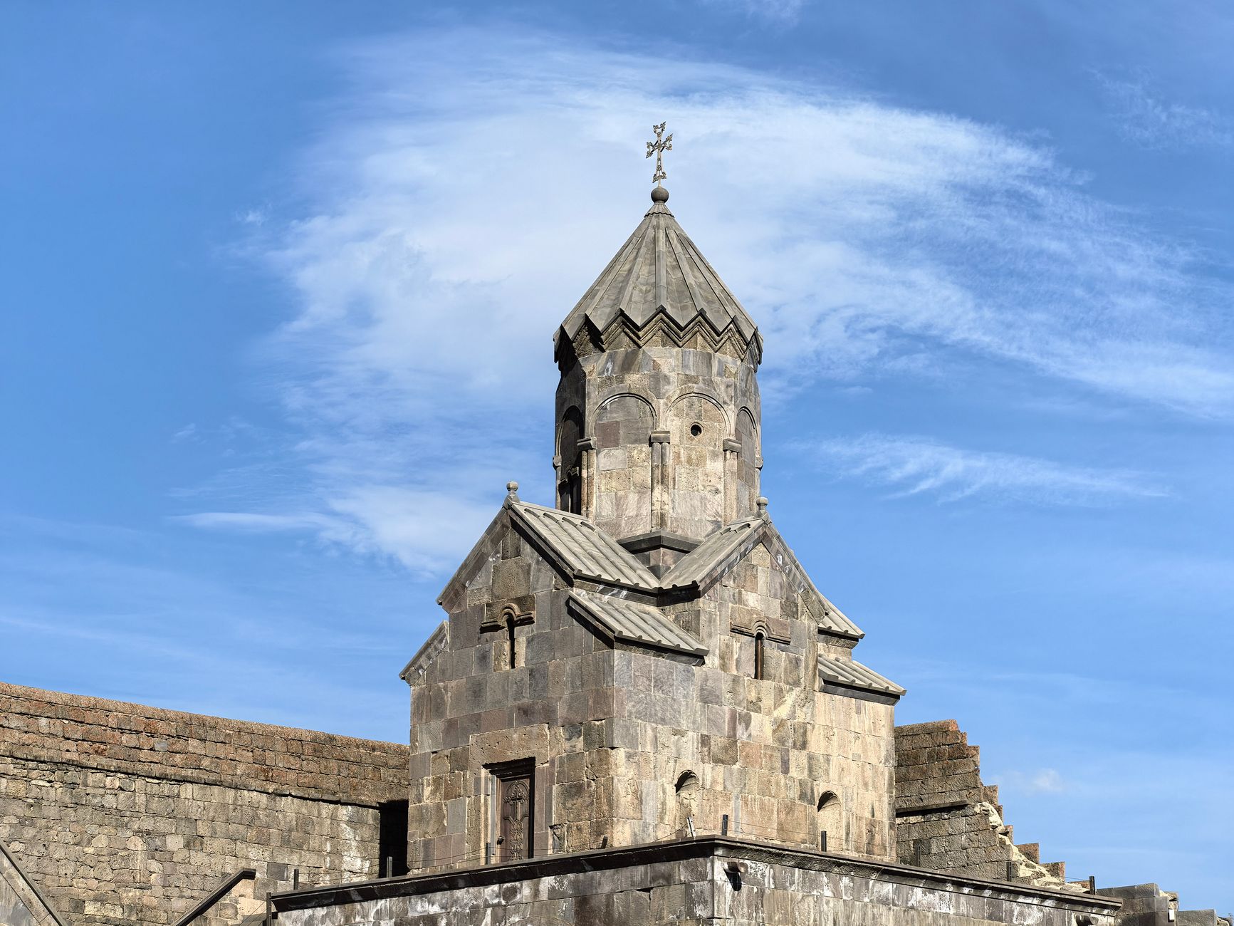 Ancient stone monastery complex with carved architectural details