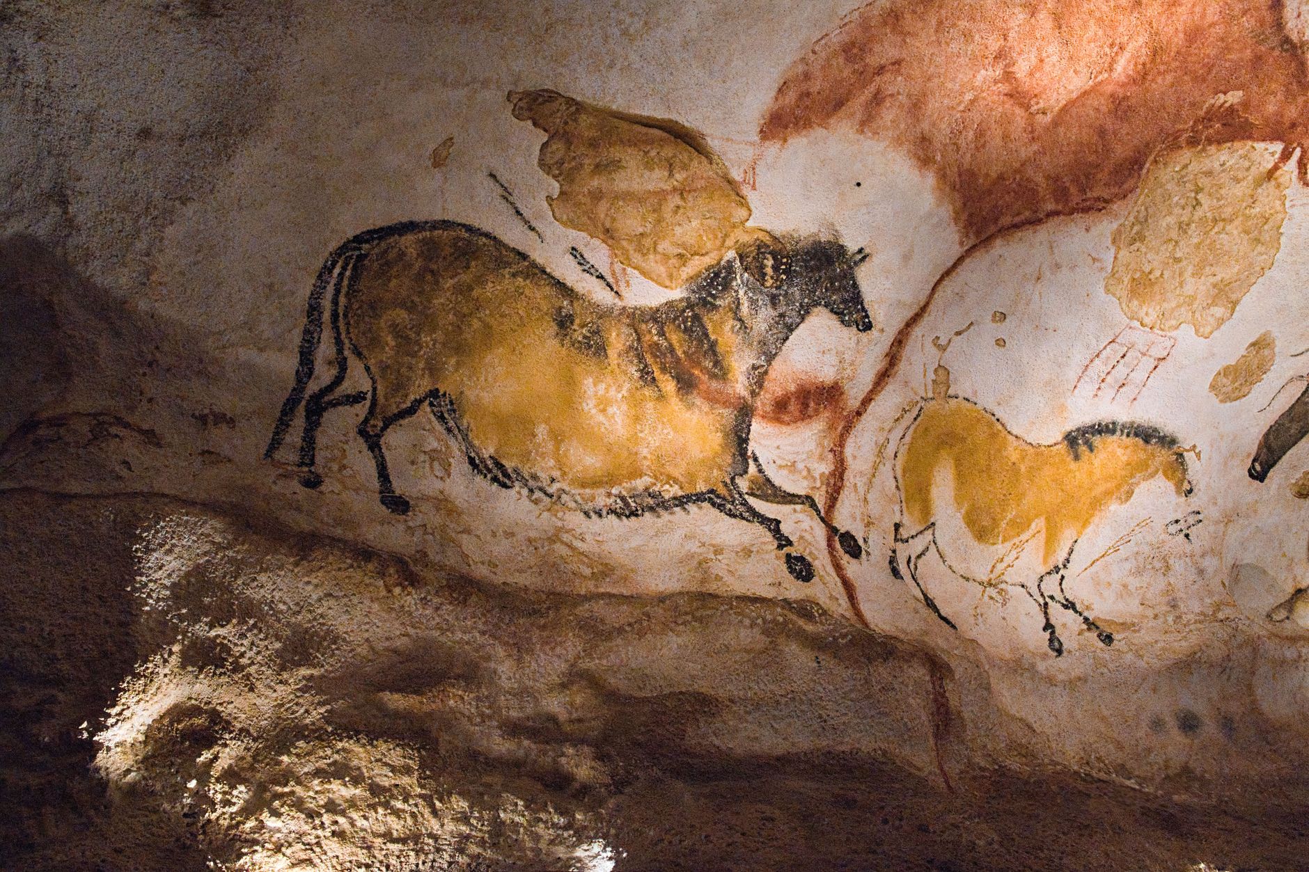 Ancient rock art paintings on sandstone cave wall