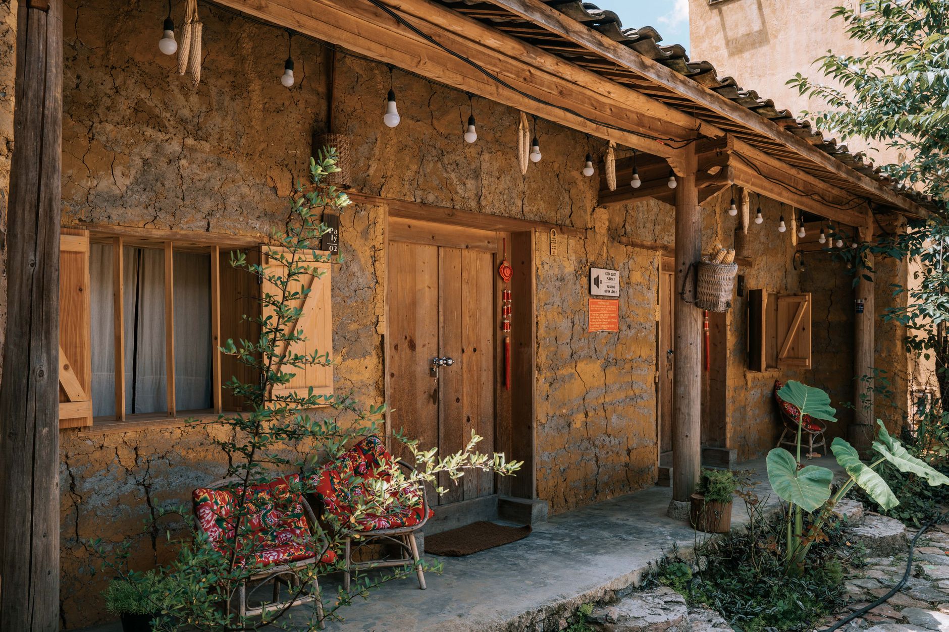 Simple family guesthouse in a Central Asian mountain village surrounded by trees