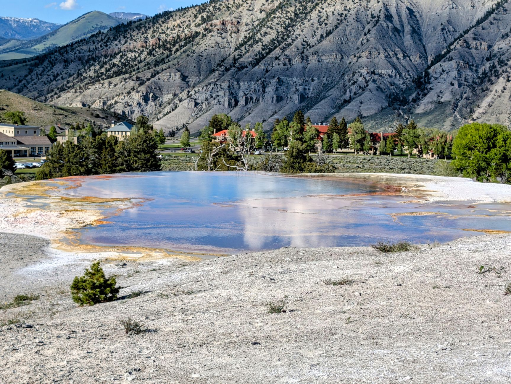 Natural geothermal hot spring pool in a high-altitude Andean landscape