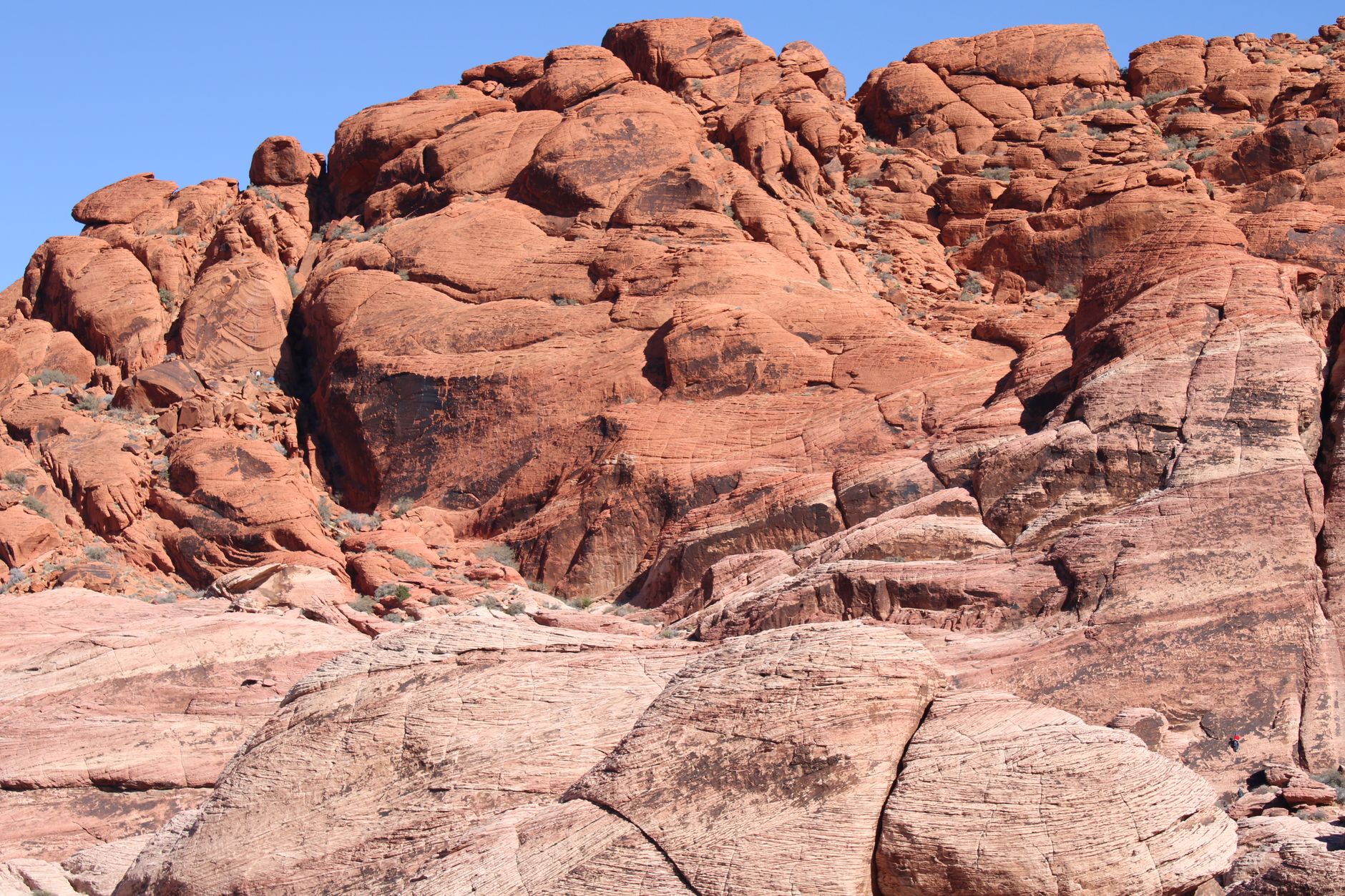 Eroded sandstone rock columns and canyon formations in a desert landscape